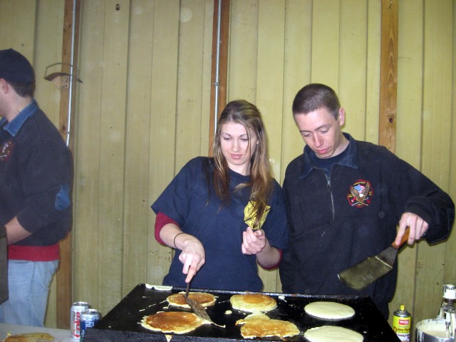 Breakfast with the Easter Bunny, 03-22-2008.  How many people does it take to make pancakes?